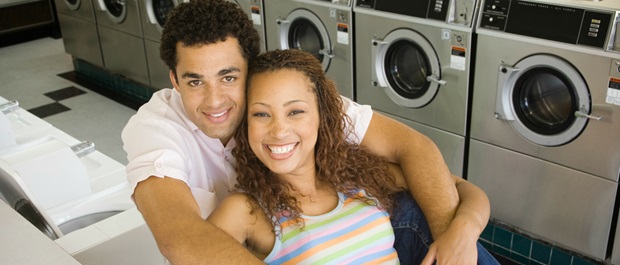 Young couple at laundromat