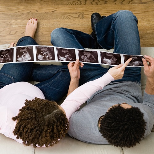 Couple Looks at Ultrasound Pictures