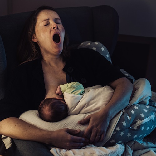 Mother at home with her infant in the first few nights.
