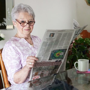 Ann reading the newspaper