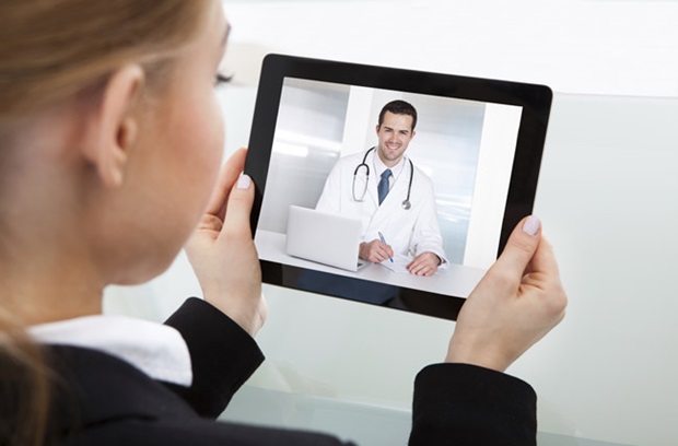 Person viewing a physician video on a tablet